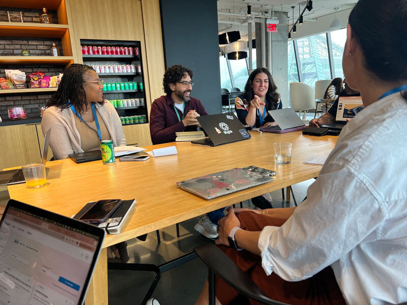 Nonprofit leaders sit in conference room during AI Accelerator