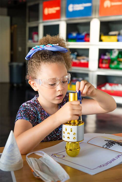 Child works on science project