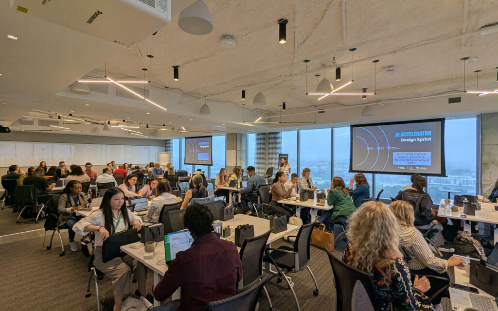 Nonprofit leaders sit in conference room during AI Accelerator