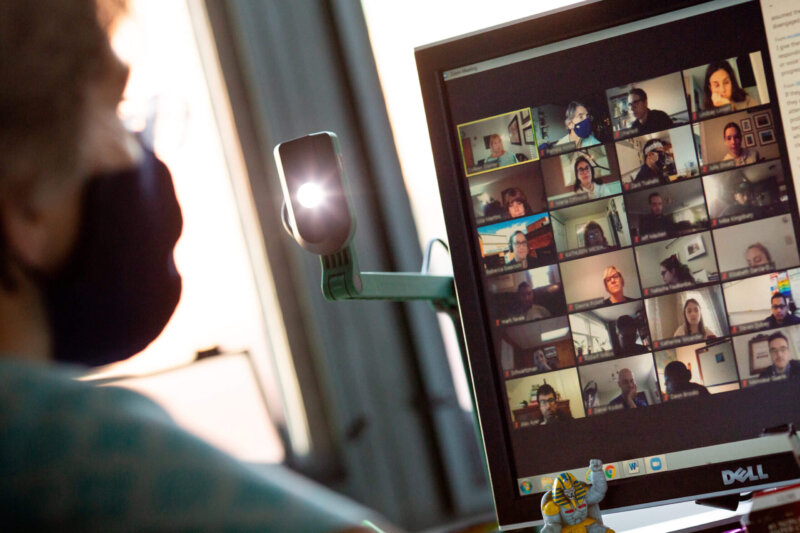 A teacher participates in an online staff meeting in her classroom at Middletown High School.