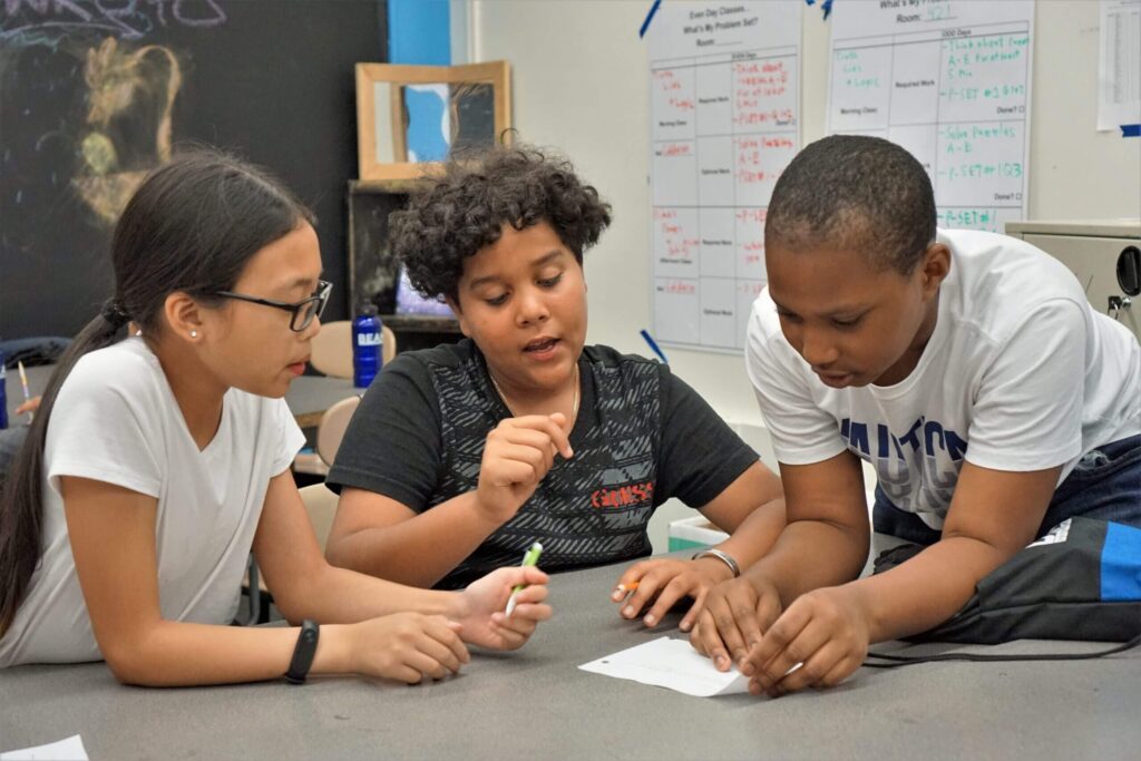 Three students working together