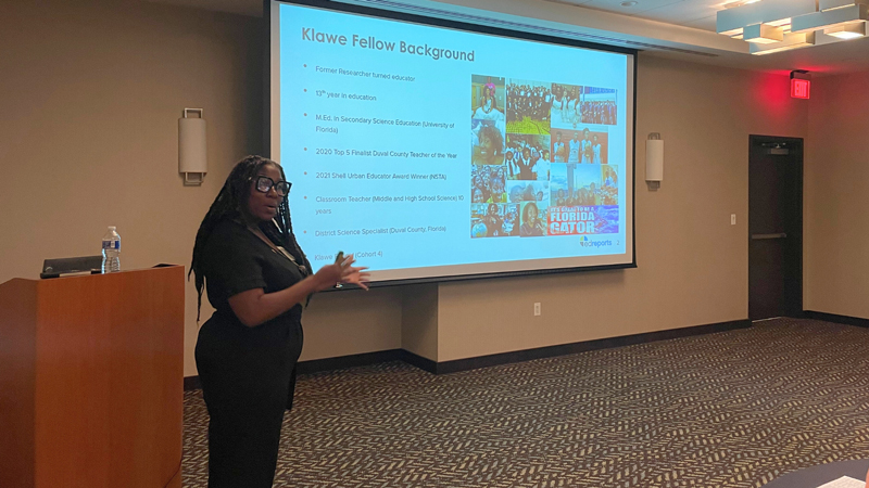 teacher stands in classroom