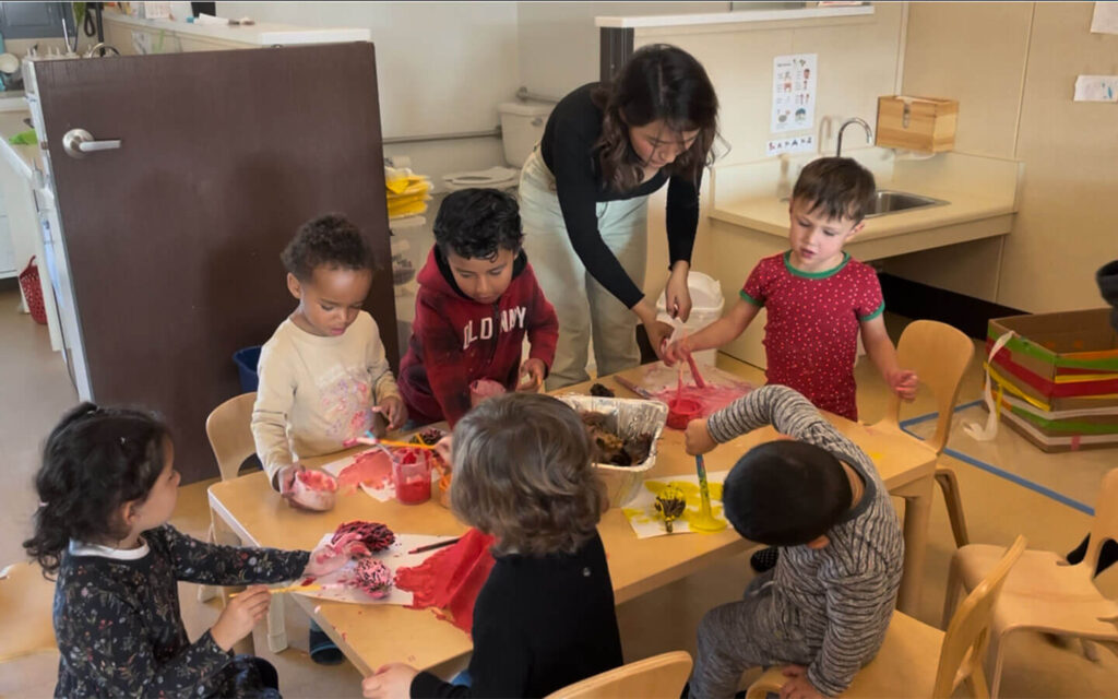 Teacher works with preschool students