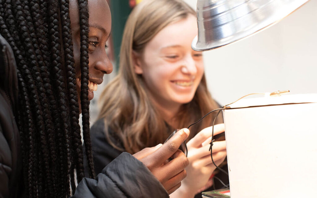 Two students work on project