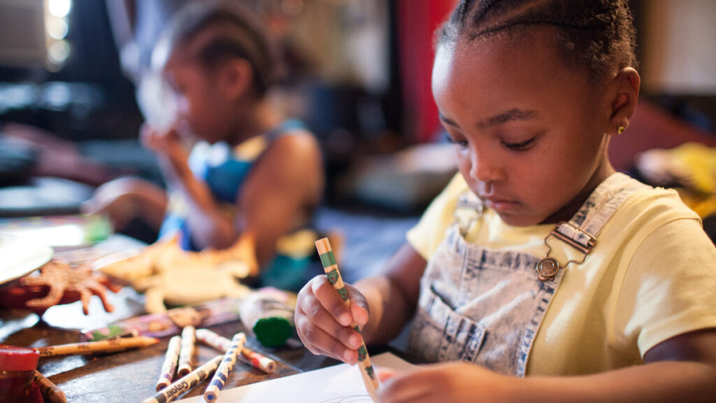 Child write on paper