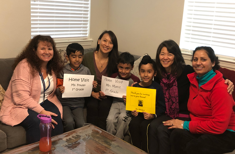 family and teacher during home visit