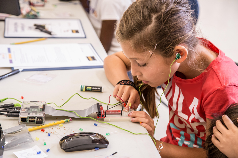 student works on science project