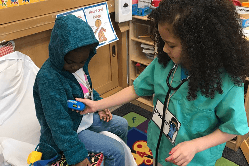 Two students play doctor together