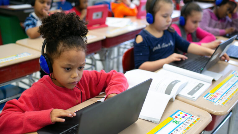 Children sit in classroom