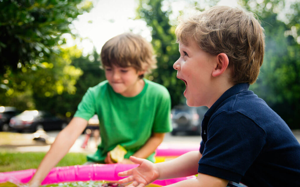 Two boys playing outside