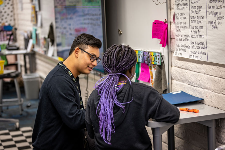 Teacher talks with student