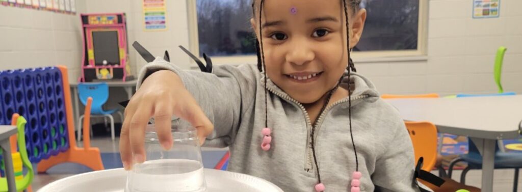 girl holds cup