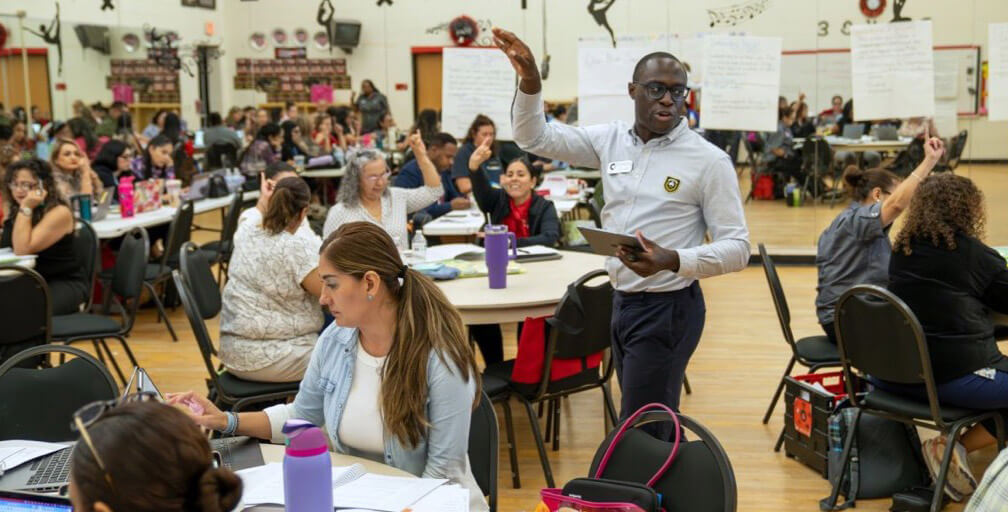teachers raise their hands
