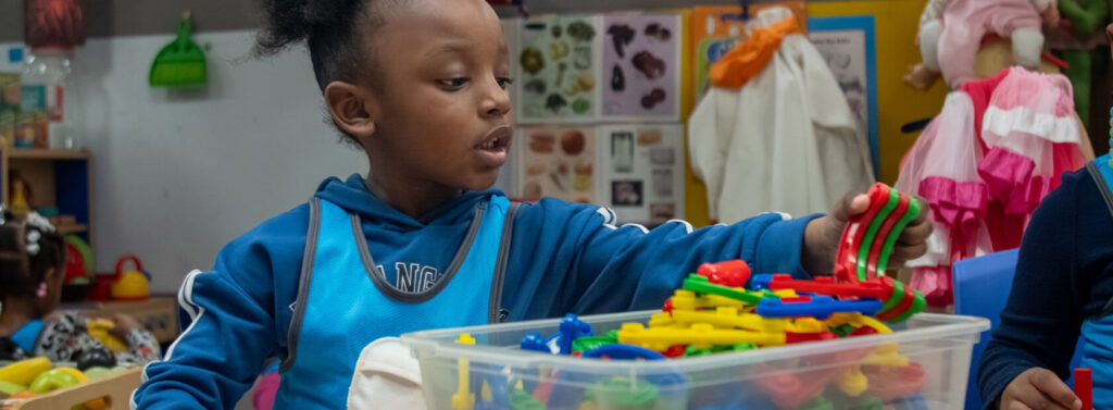 student plays with toys