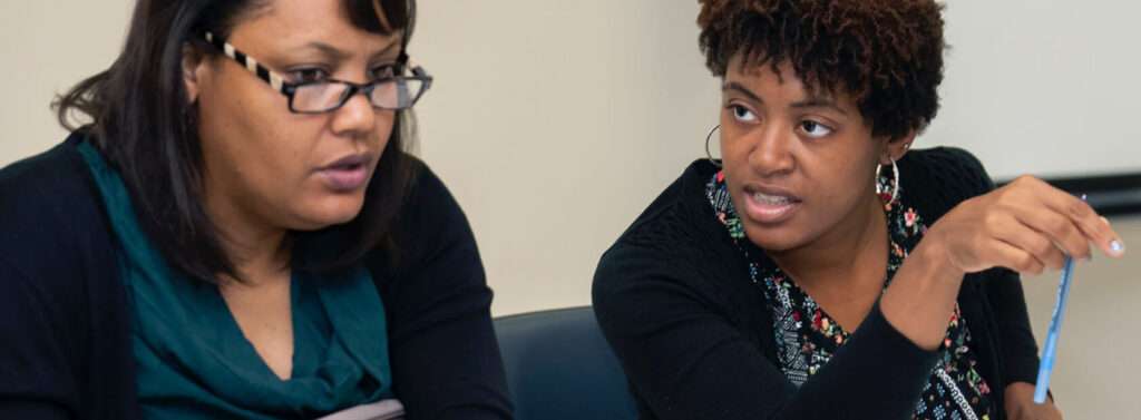 two educators talking