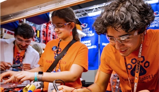 students work on robots